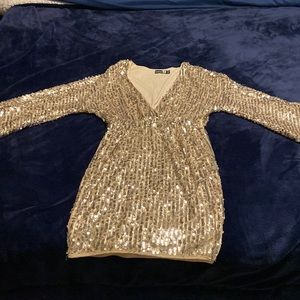 It will be your time to shine in this striped kimono sequin bodycon dress.